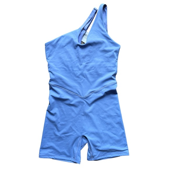 Bandier Asymmetric Tempo Short Catsuit in color Jacaranda Periwinkle - Picture 3 of 6